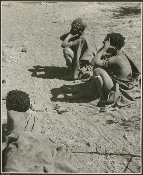 "Old /Gasa," an unidentified woman and child, and /Naoka ("Gao Medicine's" first wife) lying down (print is a cropped image)