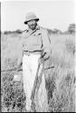 Robert Story standing and holding a gun