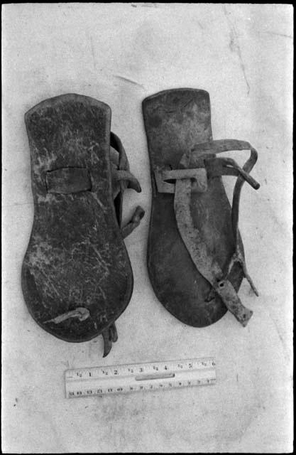 /Twikwe's sandals, with a ruler for measurement