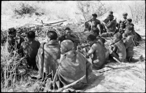 Members of the visiting band from Okwa sitting with Oukwane's group, in Oukwane's werft