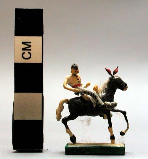 Ceramic polychrome miniature cowboy