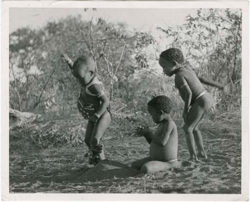 /Gaishay (son of Di!ai and "Gao Medicine"), Bau (daughter of "Crooked /Qui" and //Khuga), and "Little ≠Gao" (son of "/Qui Navel" and //Kushay) dancing a medicine dance (print is a cropped image)