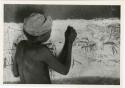 Boy drawing on the wall in Okwa