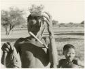 Boy with musical instrument (print is a cropped image)