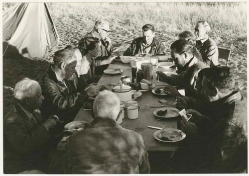 Knoble and his group sitting at a table eating