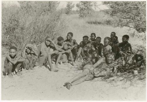 Group of people sitting under a tree