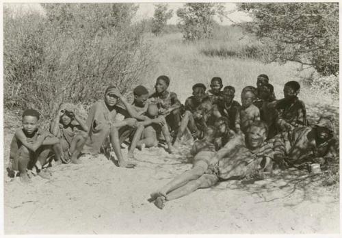 Group of people sitting under a tree