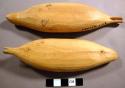 Carved wooden seals or walruses, painted flippers on underside