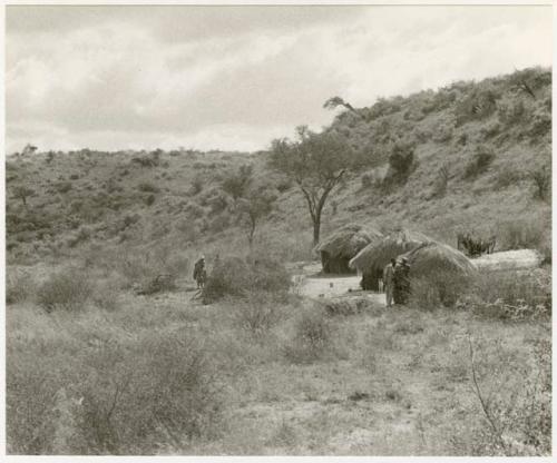 Three huts in a riverbed (print is a cropped image)