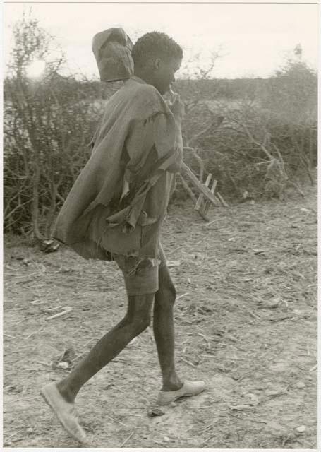 Boy with a musical instrument (print is a cropped image)