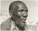 Elderly blind man wearing a kaross (print is a cropped image)