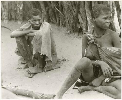 Seated man and woman at Chukudu (print is a cropped image)