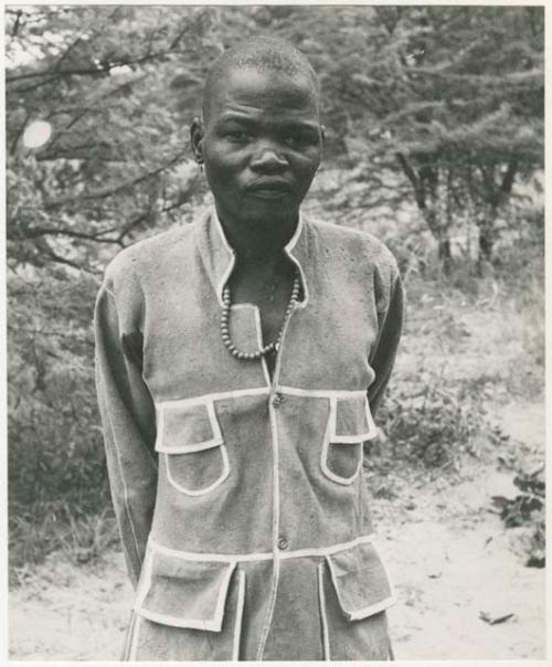 Boy in a tailored leather coat (print is a cropped image)