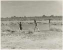 Expedition members getting water for washing (print is a cropped image)