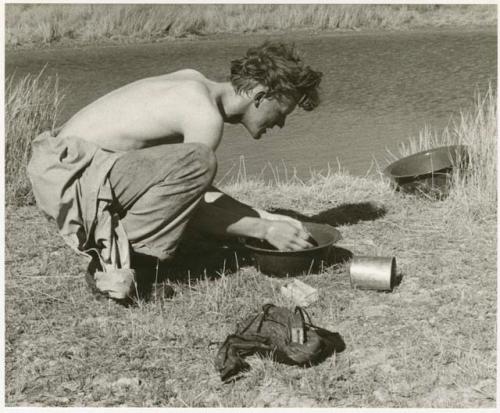 John Marshall washing from a bowl (print is a cropped image)