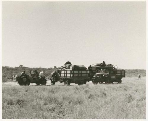 Expedition members and trucks at !Kusi Pan, from a distance (print is a cropped image)