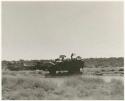 Expedition members and trucks at !Kusi Pan, from a distance (print is a cropped image)