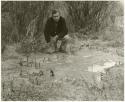 Daniel Blitz beside a staked-out hide (print is a cropped image)