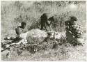 Oukwane and !Gai skinning a gemsbok; John Marshall kneeling while filming (print is a cropped image)