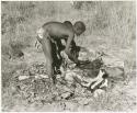 Oukwane and !Gai cutting up a gemsbok (print is a cropped image)