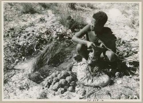 Oukwane sitting with gemsbok stomach bag