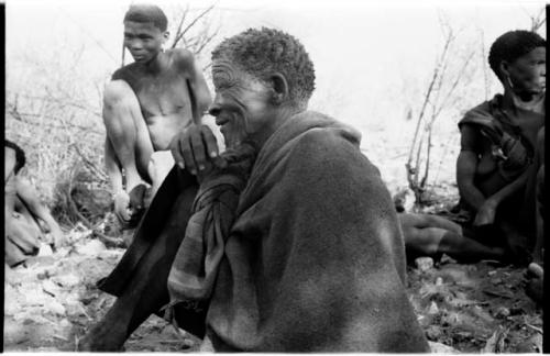 Elderly man and young man sitting