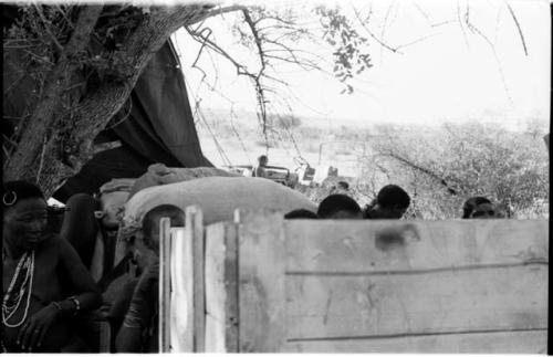 Ju/'hoansi on top of a loaded expedition truck