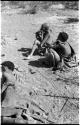 "Old /Gasa," an unidentified woman and child, and /Naoka ("Gao Medicine's" first wife) lying down