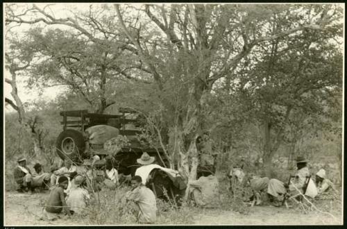 Group sitting around an expedition truck