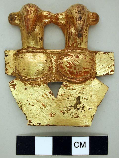 One gold plated copper shield with penguin shaped figures