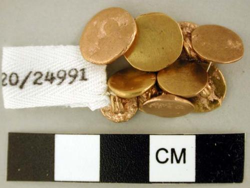 Gold buttons (10)  1.3 cm max.; .9 cm min.