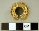 Gold filigree nose ring, very ornate.  2.5 cm. diameter (widest); 1.25 cm. high.