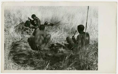 Four men, including "Crooked /Qui," digging for poison beetles