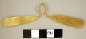 Winged or paddle-shaped gold nose ornament.