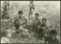 Ju/'hoan women, children, and a man sitting