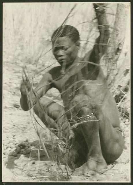 Gao sitting and holding a carrying net