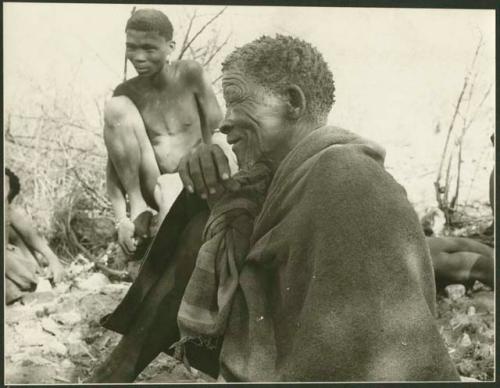 Elderly man and young man sitting