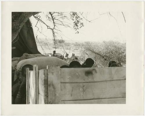 Ju/'hoansi on top of a loaded expedition truck (print is a cropped image)