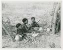 Three children sitting in the werft of the people from the northeast, eating mealies