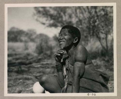 Woman seated, smiling