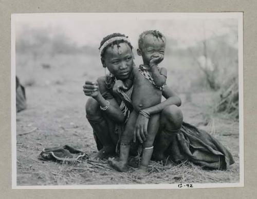 Wife of Gao, brother of Gau, holding her little boy
