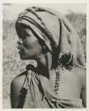 Woman with a piece of blanket on her head, close-up
