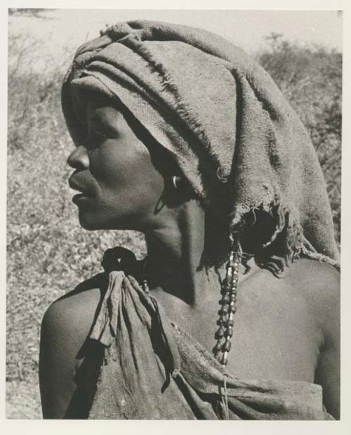 Woman with a piece of blanket on her head, close-up