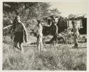 Lorna Marshall, Elizabeth Marshall Thomas, and two other expedition members clearing the camp site
