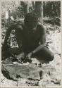 Oukwane scraping sansevieria fibers to make a cord