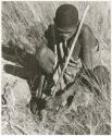 /Twikwe digging with digging stick (print is a cropped image)