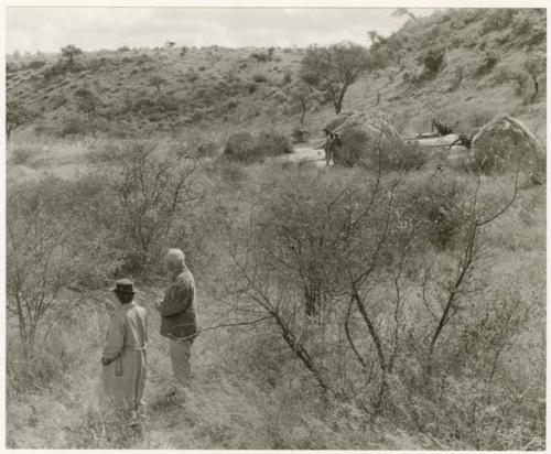 Laurence Marshall and Lorna Marshall standing on omuramba bank (print is a cropped image)