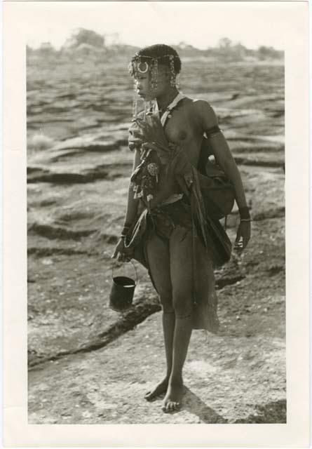 "Beautiful !Ungka and her cousin": !Ungka's cousin carrying a tin of water