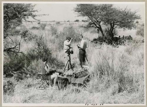 Group of people being interviewed by Lorna Marshall, with Kernel Ledimo and Dabe interpreting