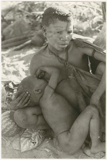 Tsekue nursing N!whakwe (print is a cropped image)